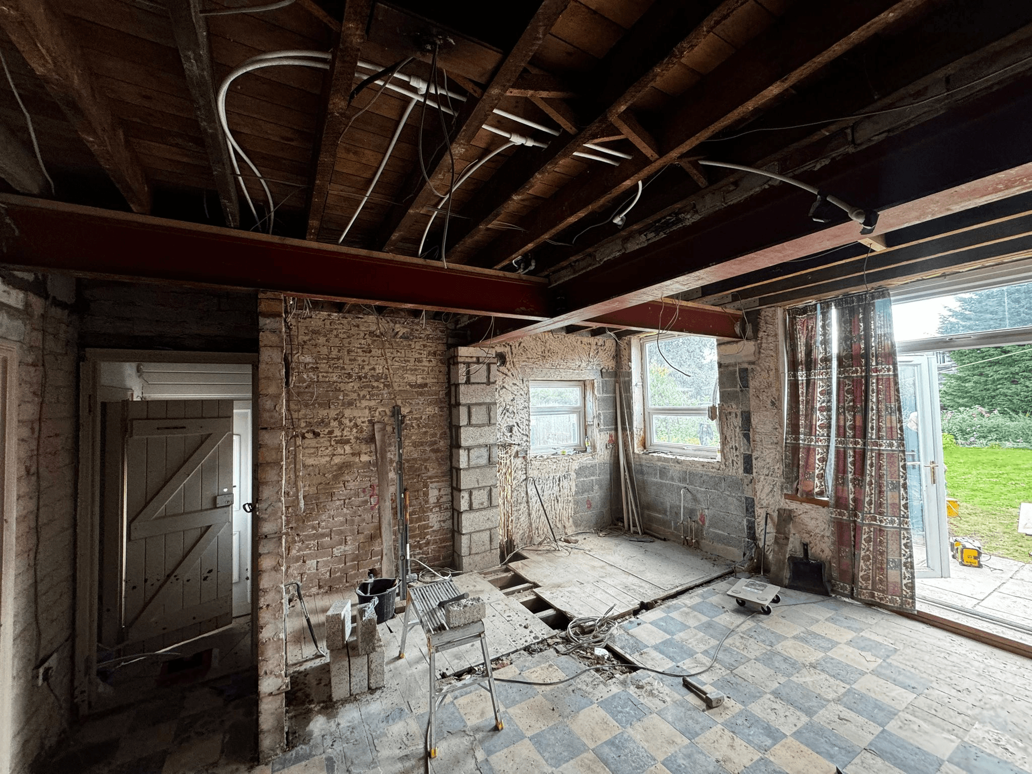 Room stripped back to brick for extension conversion